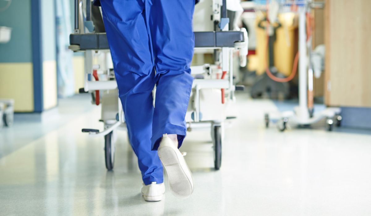 Surgeon pushing bed