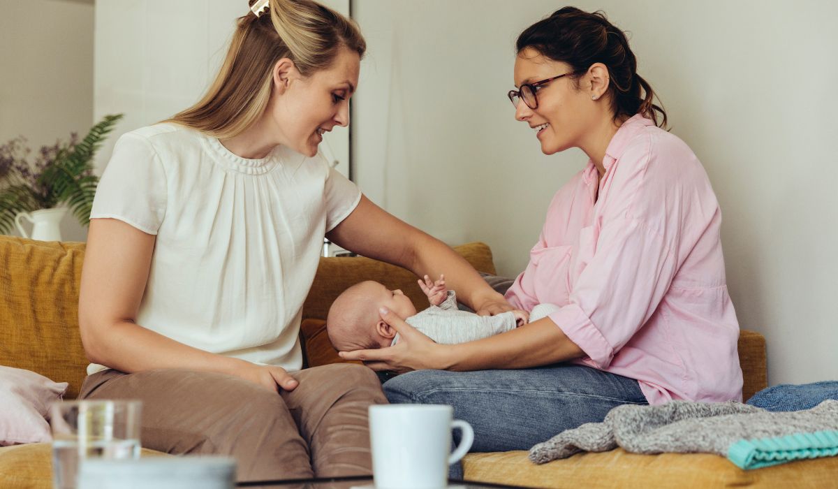 Midwife with a new mum and a newborn