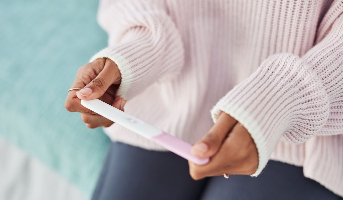 Woman looking at pregnancy test