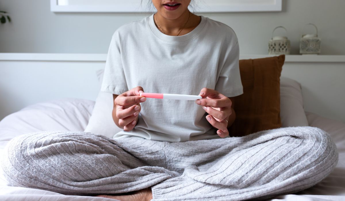 Woman looking at pregnancy test