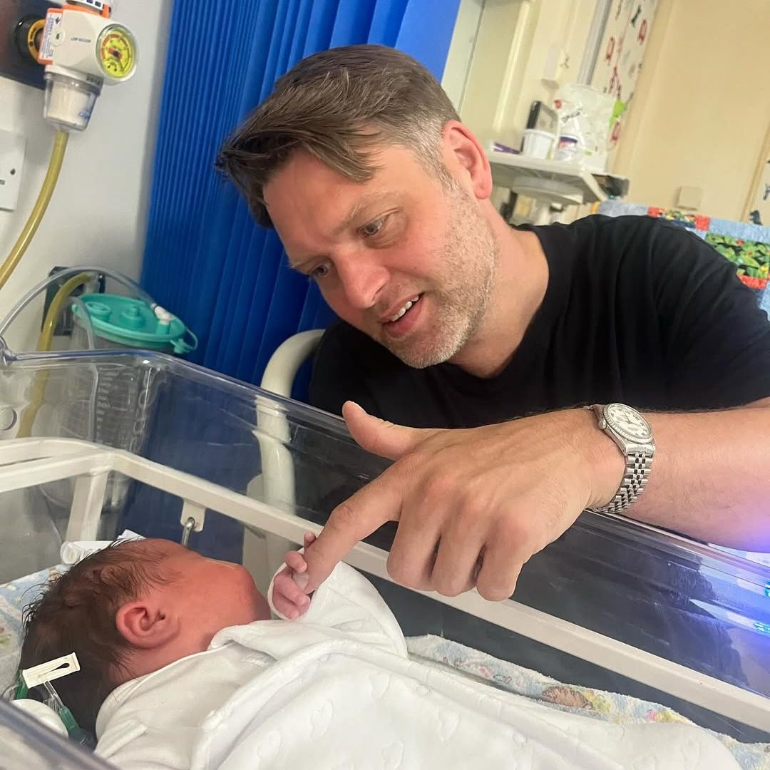 Amelia Lily's partner Eddie with their newborn daughter Pearl