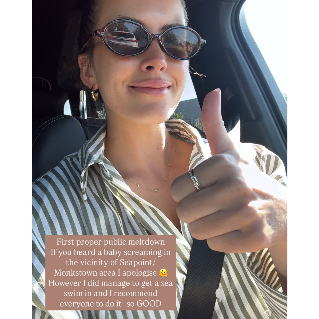 Anna Madigan with her thumb up in the car