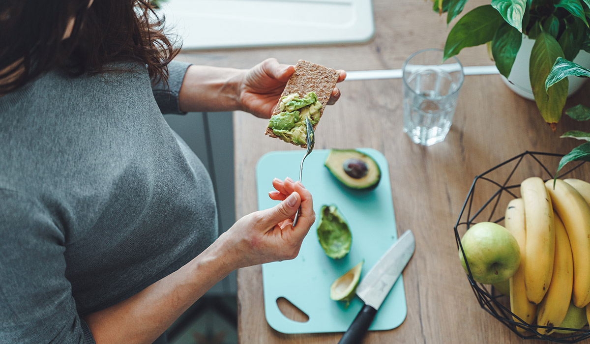 Pregnant woman making healthy toast with avocado. Pic: Getty Images
