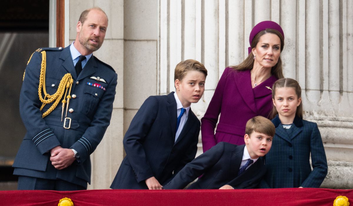 Prince William, Prince of Wales, Prince George, Catherine, Princess of Wales, Prince Louis and Princess Charlotte watch the flypast to mark the 80th anniversary of VE Day on May 05, 2025 in London, England.