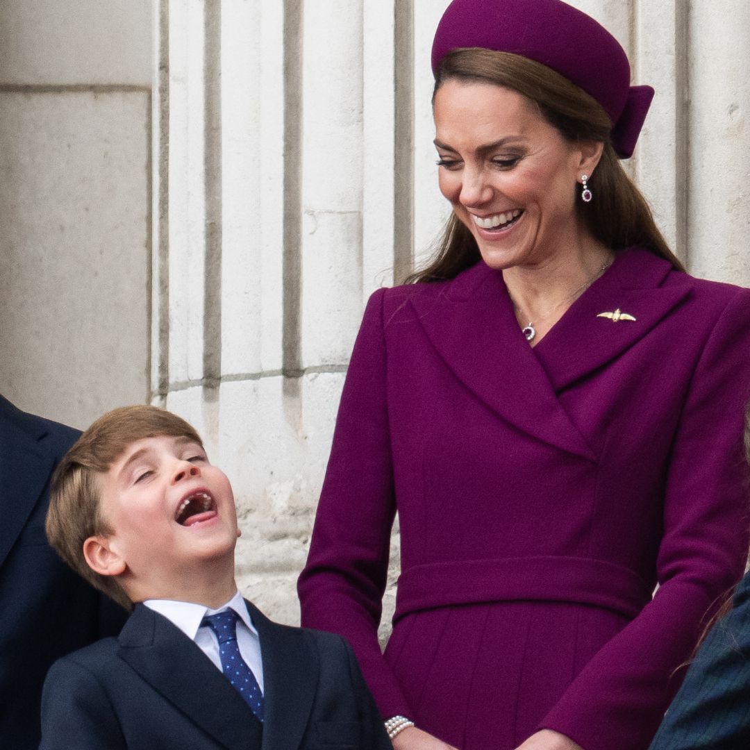 Catherine, Princess of Wales and Prince Louis of Wales watch the fly-past on the balcony of Buckingham Palace.