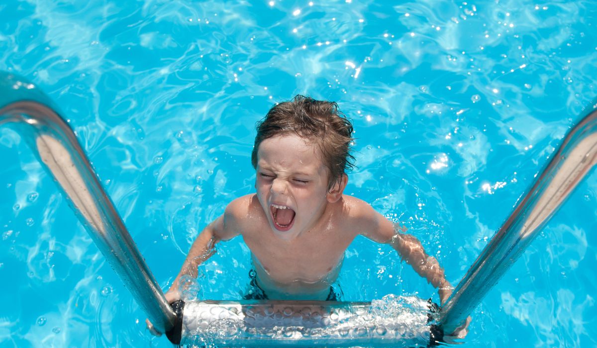 Child screaming getting out of the swimming pool