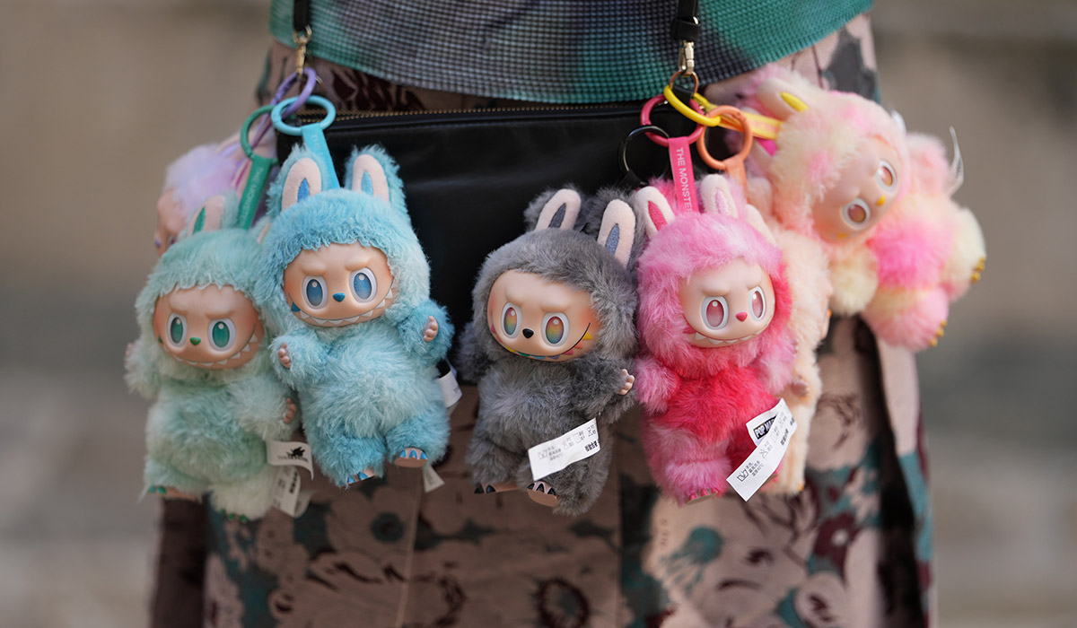 Seven Labubu monsters / charms / dolls / plus from "Big Into Energy" collection : Loyalty, Happiness, Luck, Hope, Serenity, Love an Secret, during a street style fashion photo session, on June 12, 2025 in Paris, France. (Photo by Edward Berthelot/Getty Images)