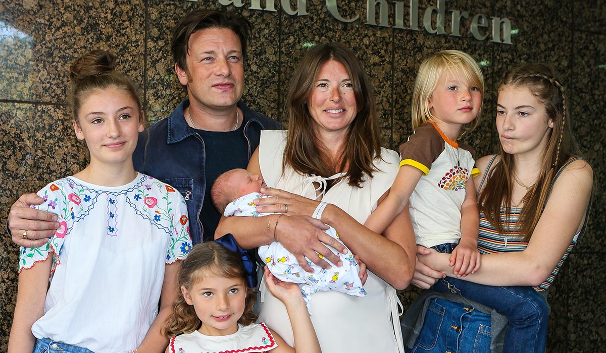 Jamie Oliver, Jools Oliver and their family pose with their new baby at The Portland Street Hospital on August 8, 2016 in London, England.