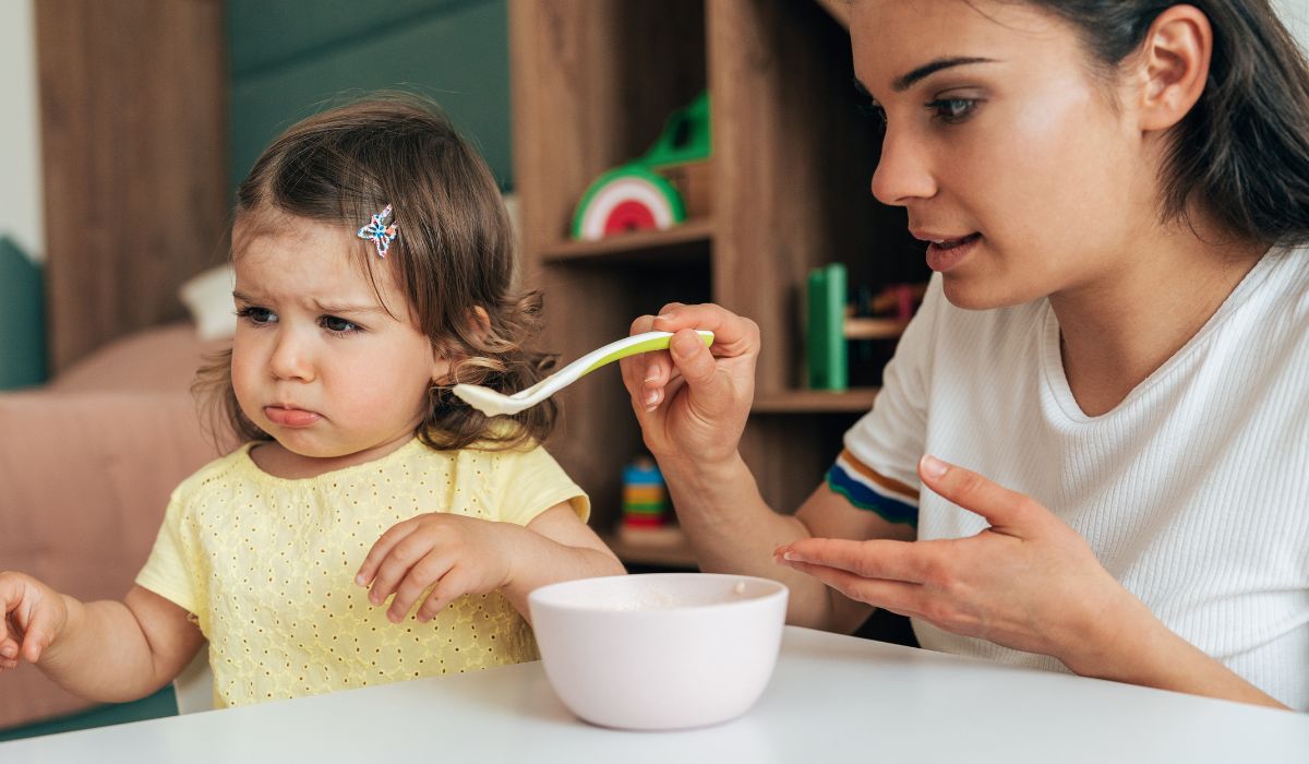 Mother feeding her toddler