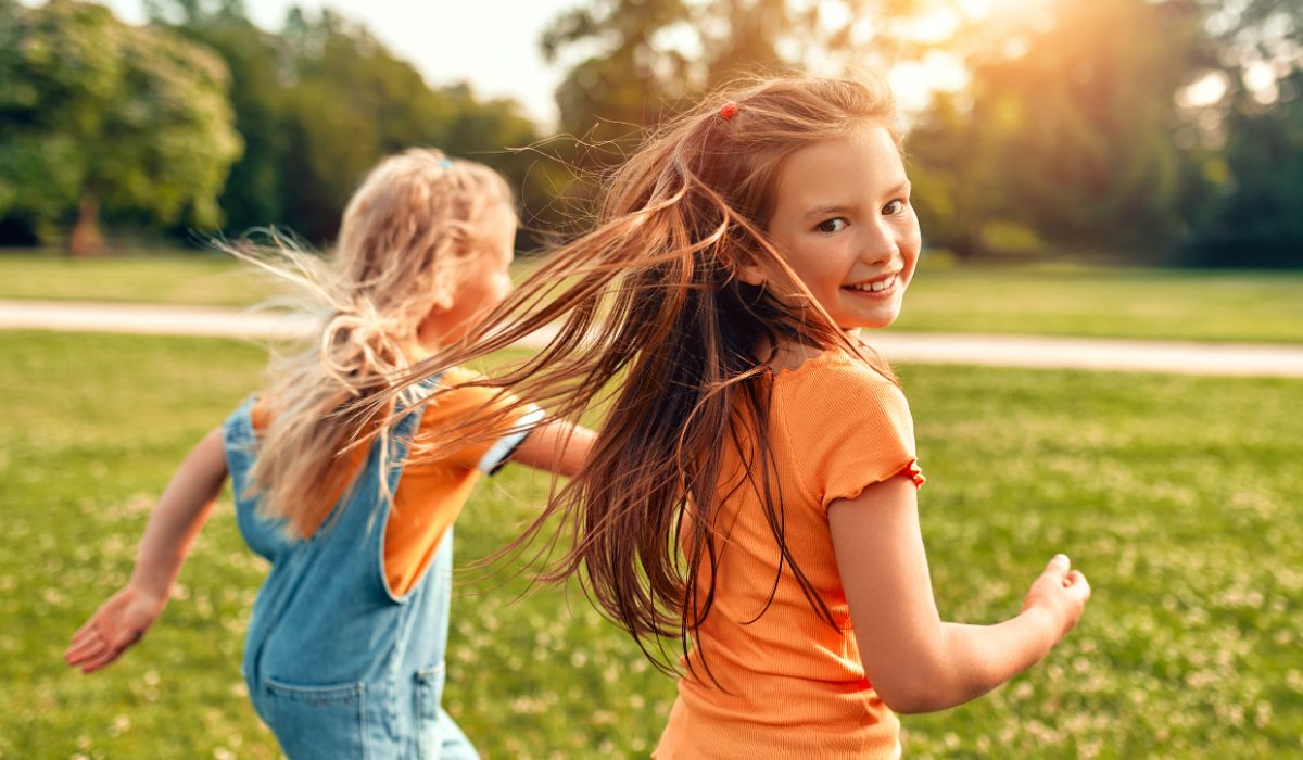 Kids running outside in summer