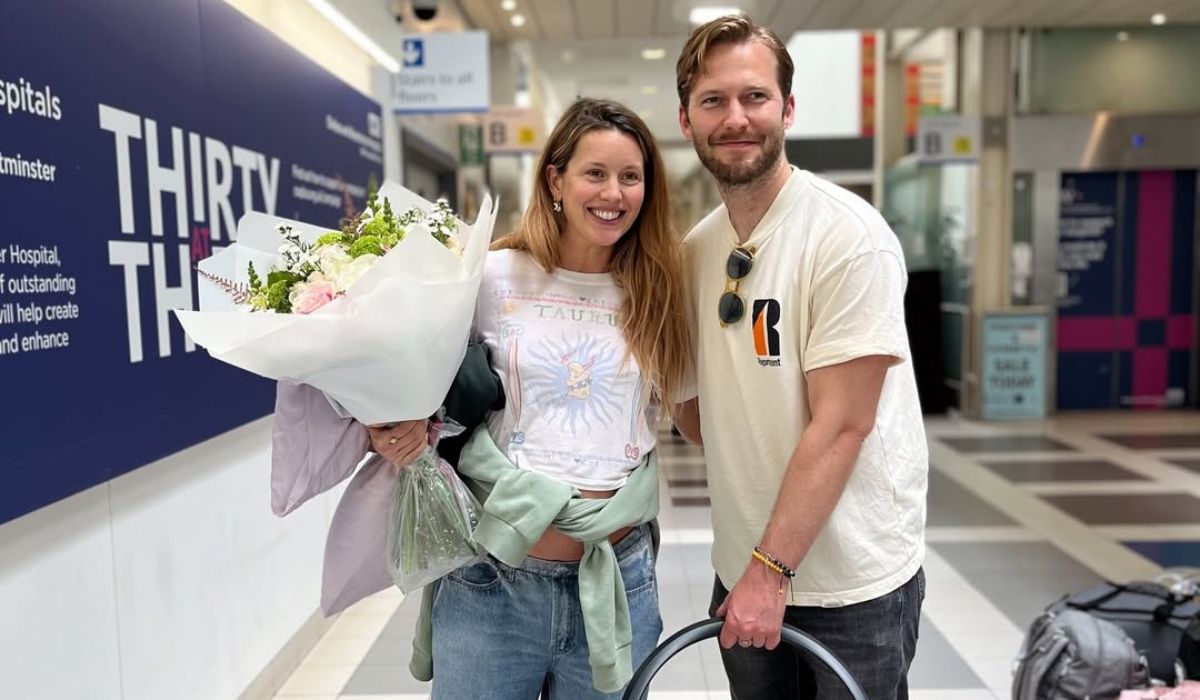 Caggie Dunlop, her partner and their baby