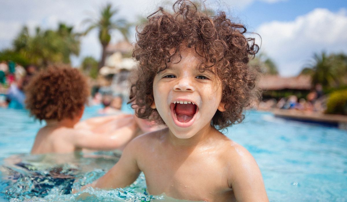 Kids in pool on holiday