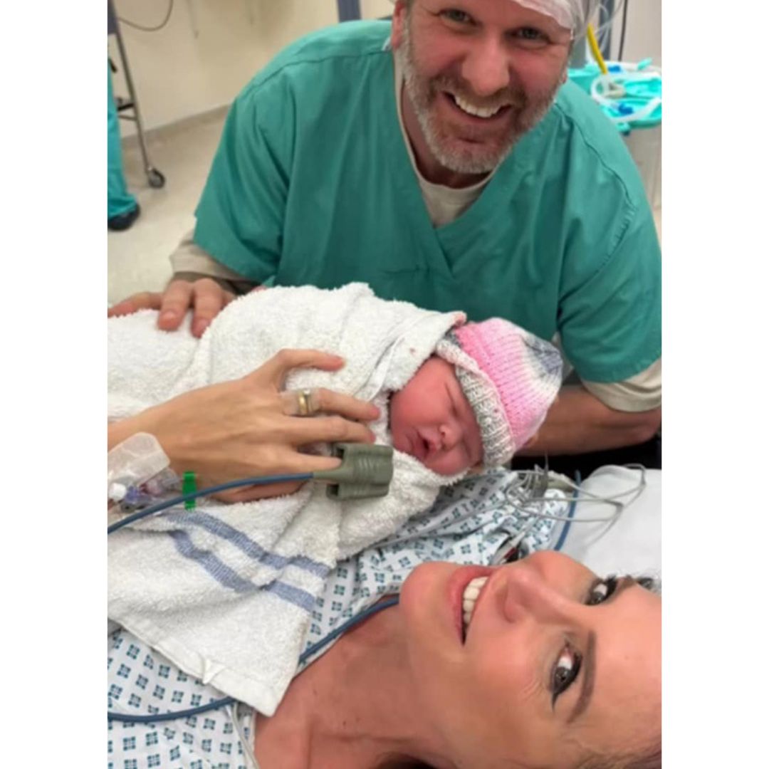 Emma Kenny and her husband Pete with their newborn daughter