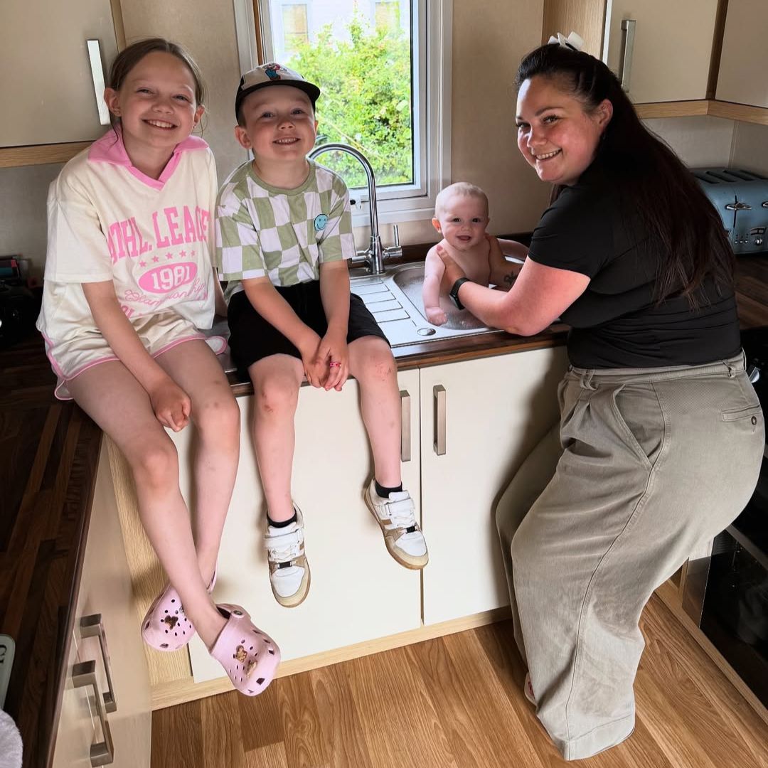 Grace Mongey and her kids with her baby in the bath