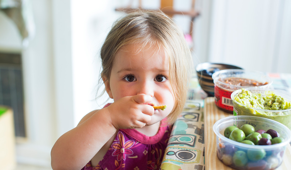 little girl (2yrs) sampling the appetizers