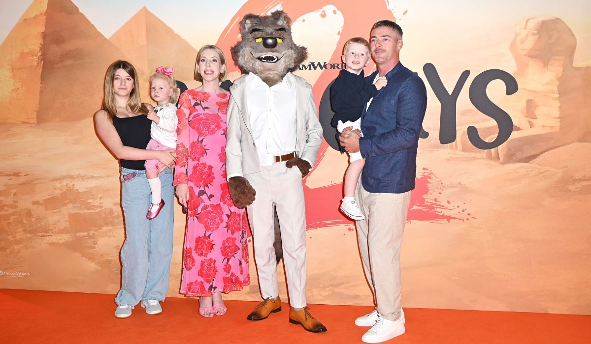 Katherine Ryan (C) and family pose with Mr. Wolf at the Gala Screening of "The Bad Guys 2"