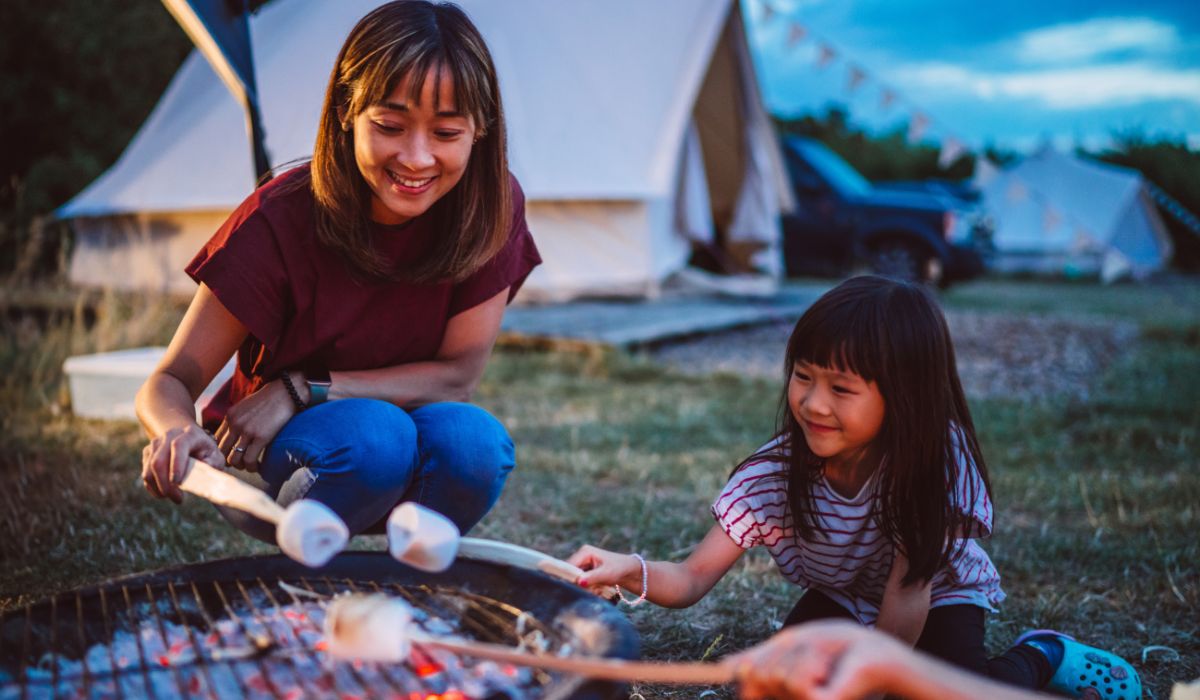 Mother and daughter making smores