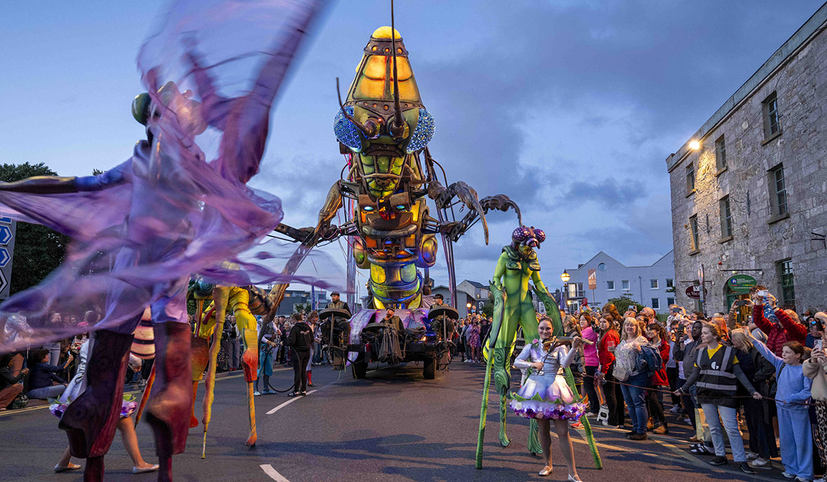 A twelve-meter grasshopper with dazzling eyes, carrying musicians and acrobats on its back! Pic: Andrew Downes, Xposure