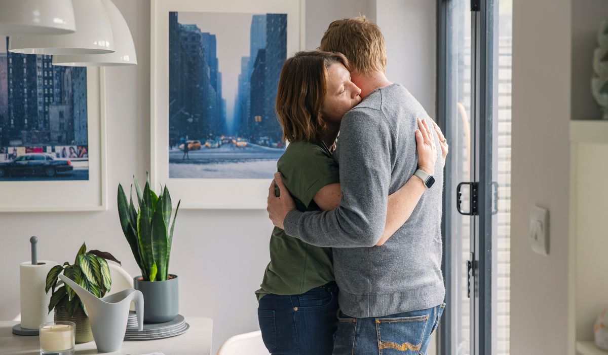 Sad couple hugging