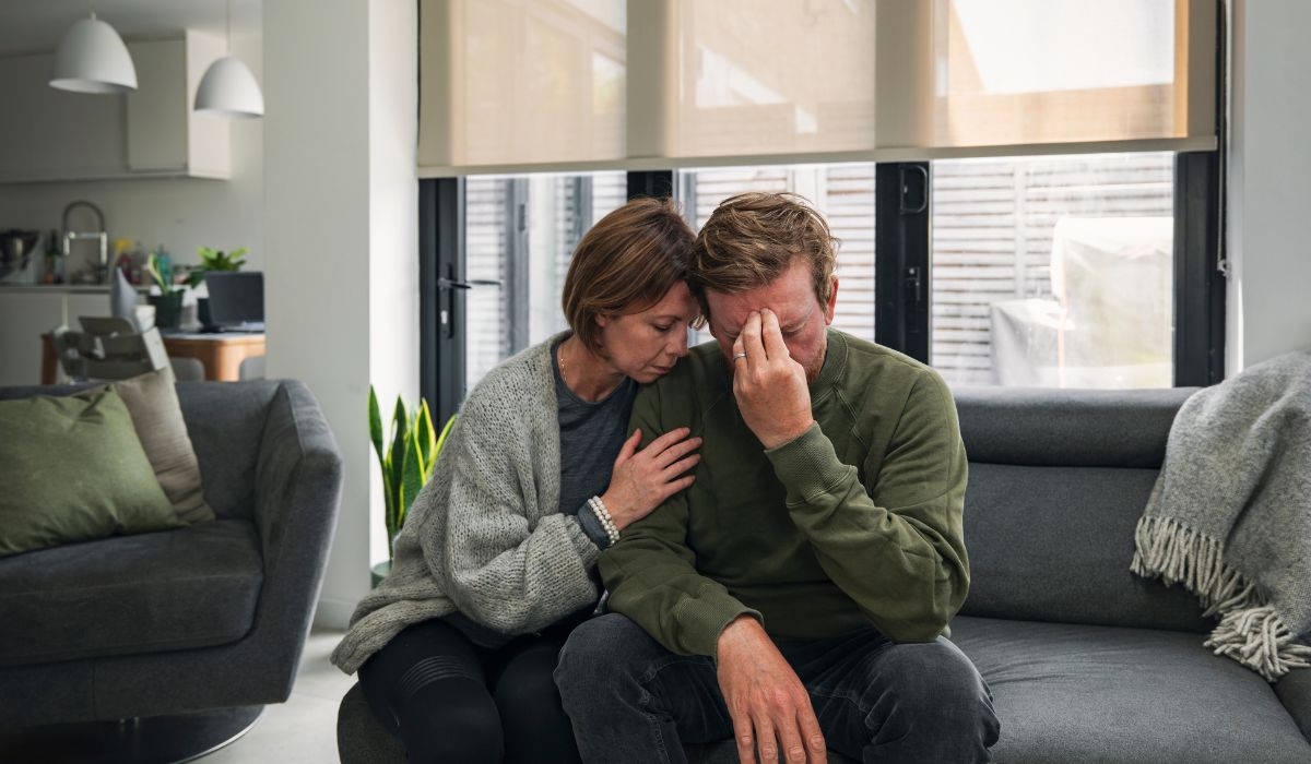 Sad couple on couch