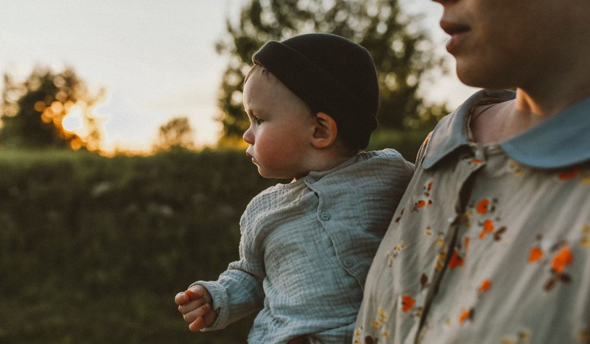 Mum holding baby in a hat