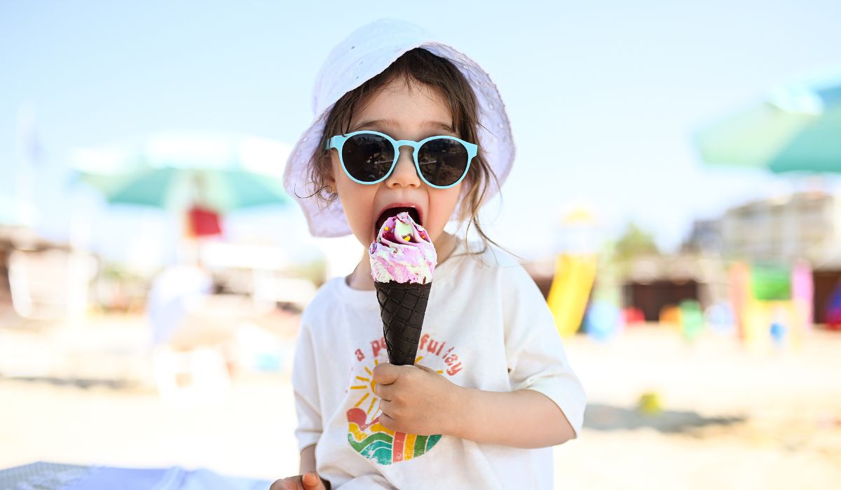 Toddler eating an ice cream in summer