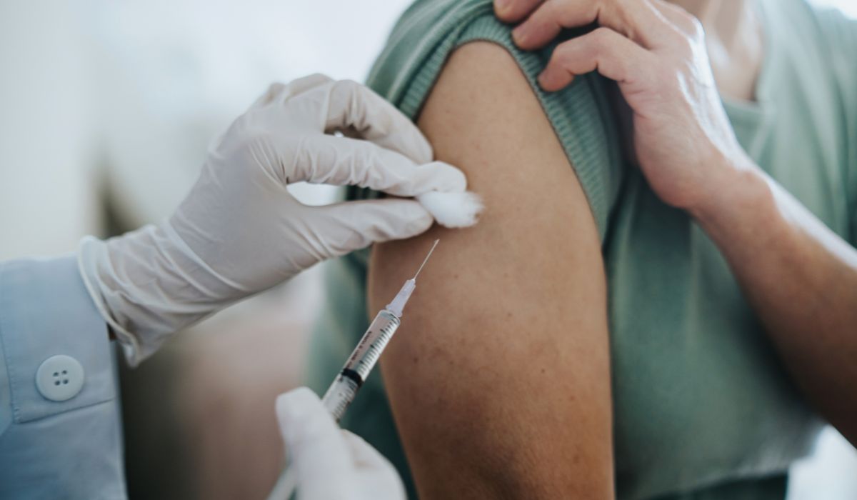 Doctor giving woman injection