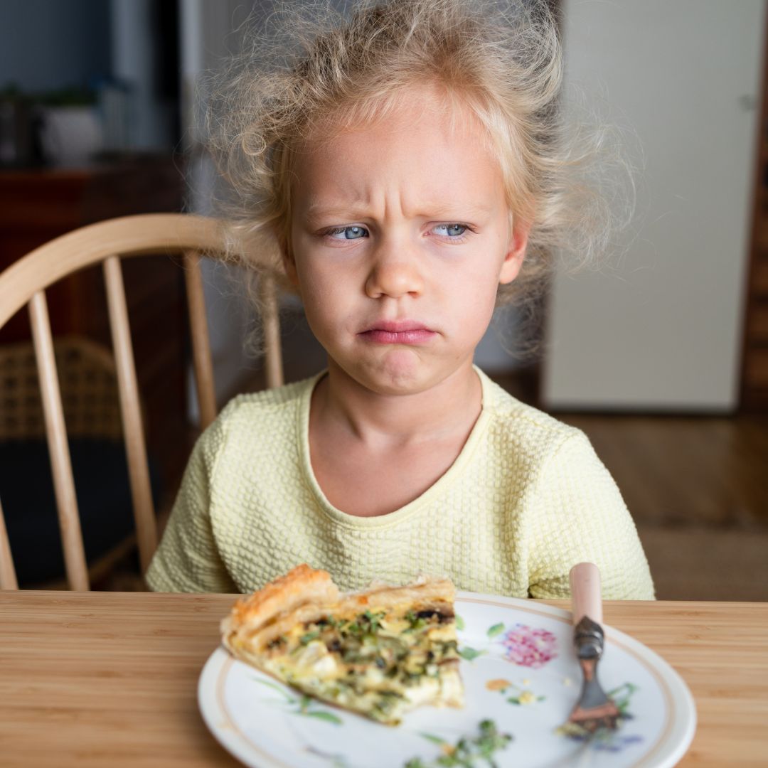 Girl not happy when she's eating