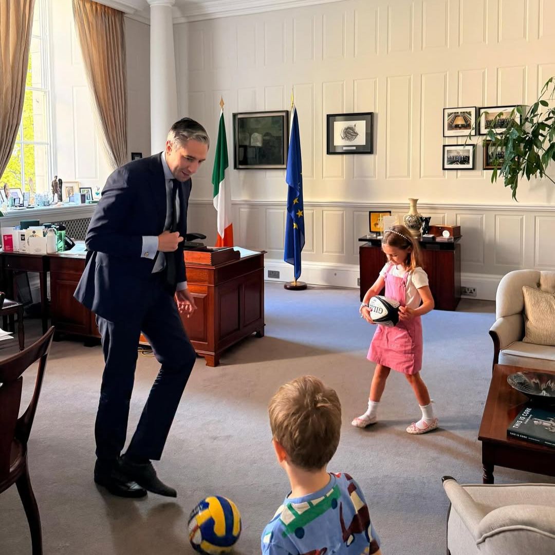 Simon Harris with his kids in government buil.dings