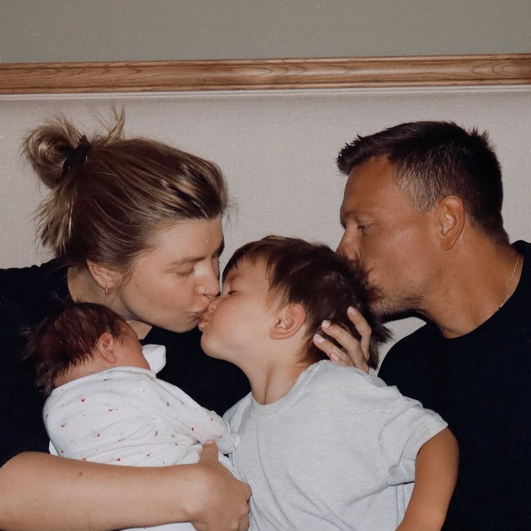 Olivia Bowen kisses her son after welcoming baby