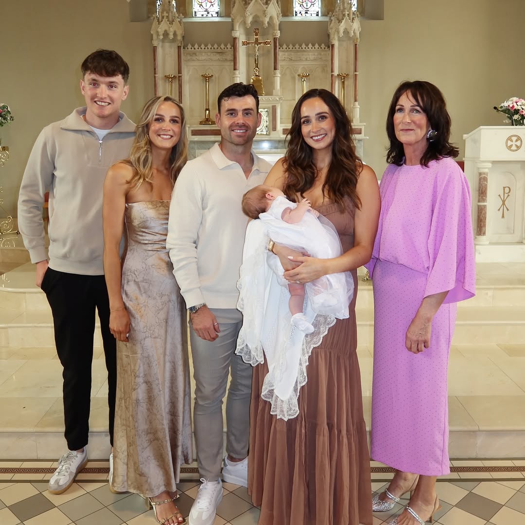 Darren and Ria McCurry at baby Renn's christening with family