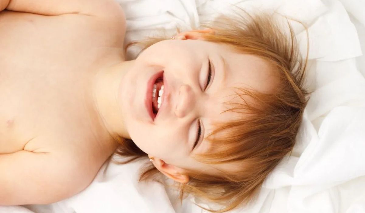 Happy baby in bed