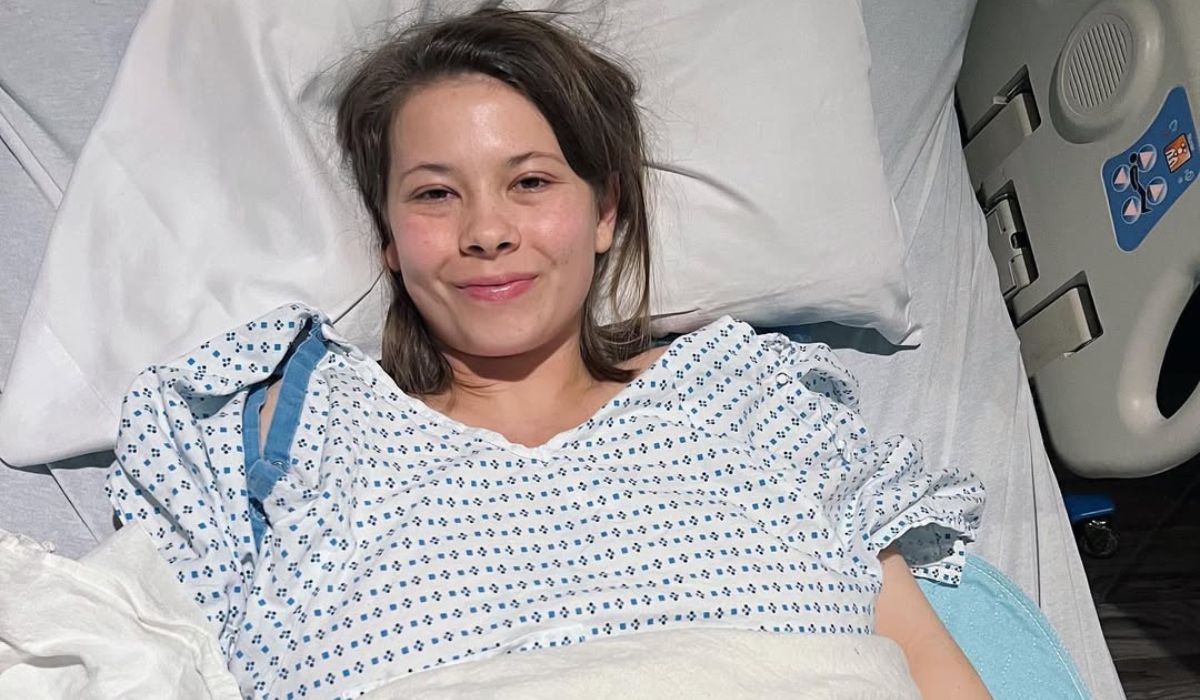 Bindi Irwin lying in a hospital bed