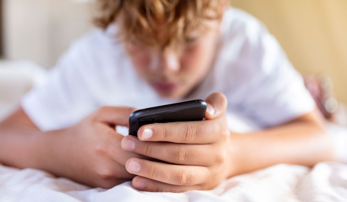 Teenager on his phone