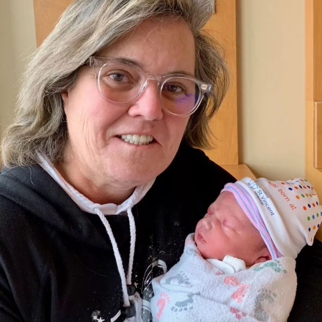 Rosie O'Donnell holding her grandchild