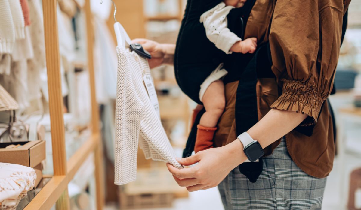 Mother holding baby in carrier