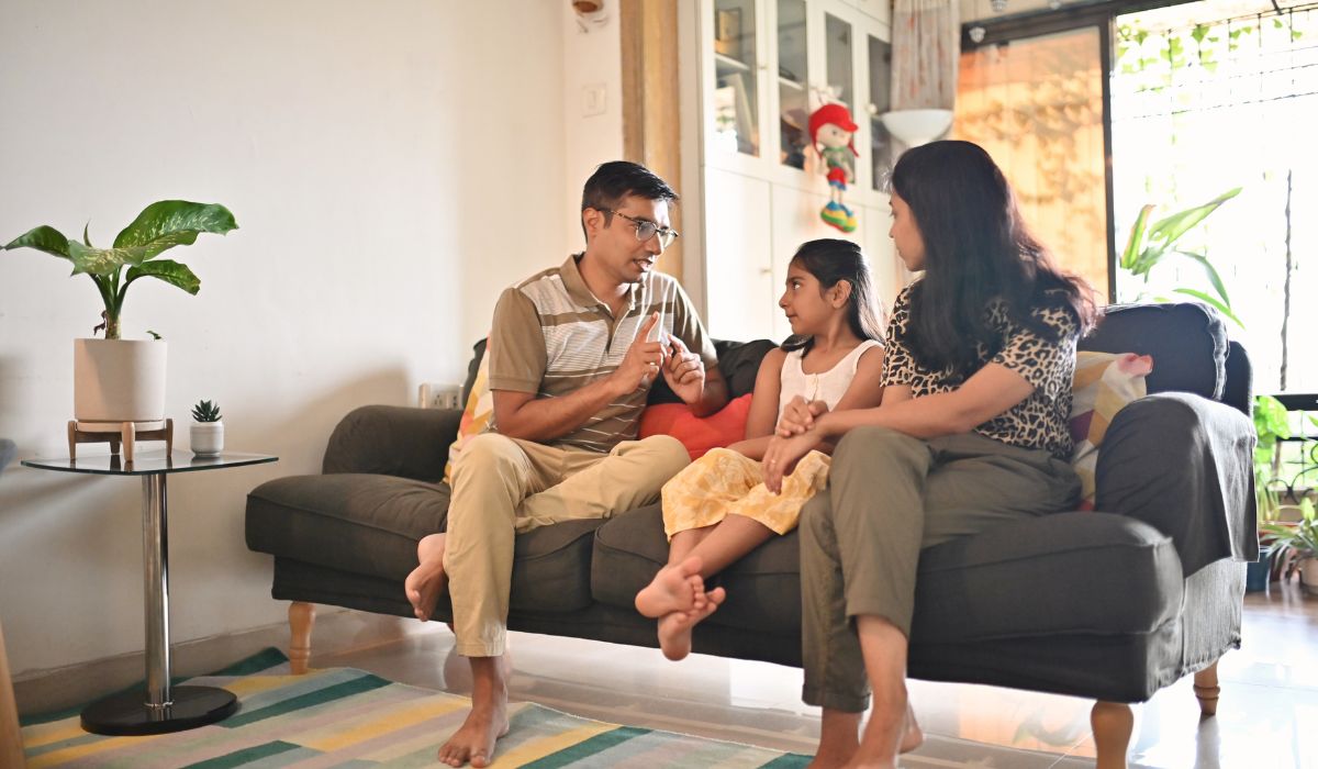 Parents talking to little girl