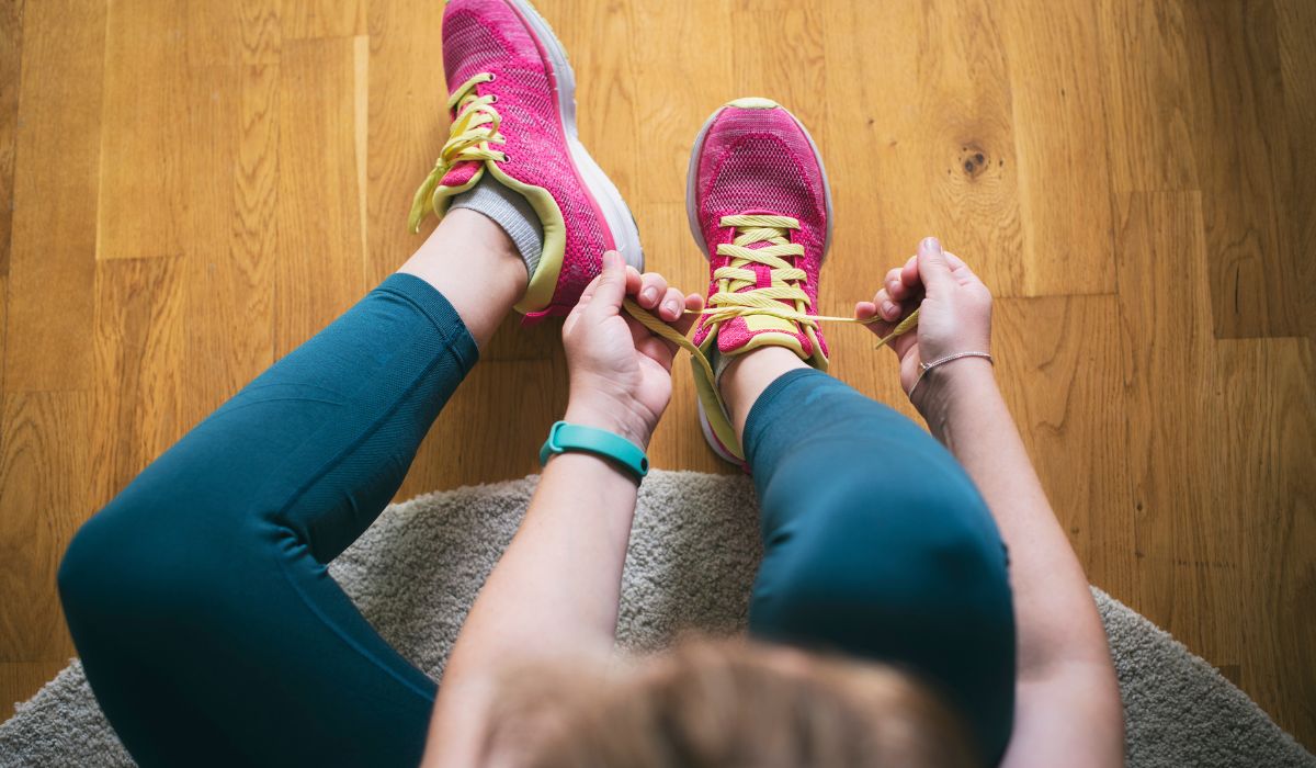 Woman putting on her trainers