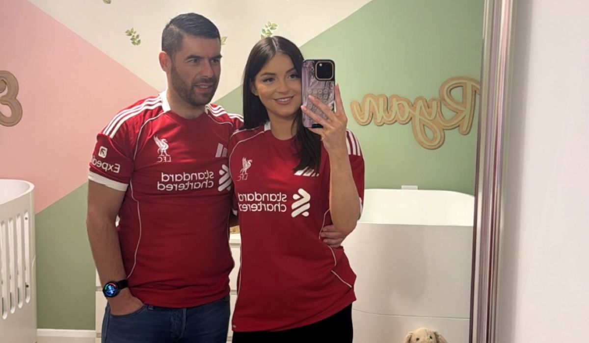 Rachel Gorry and her partner Eddie in Liverpool jerseys