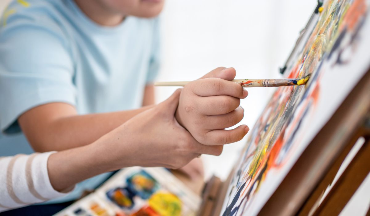 Child painting at school