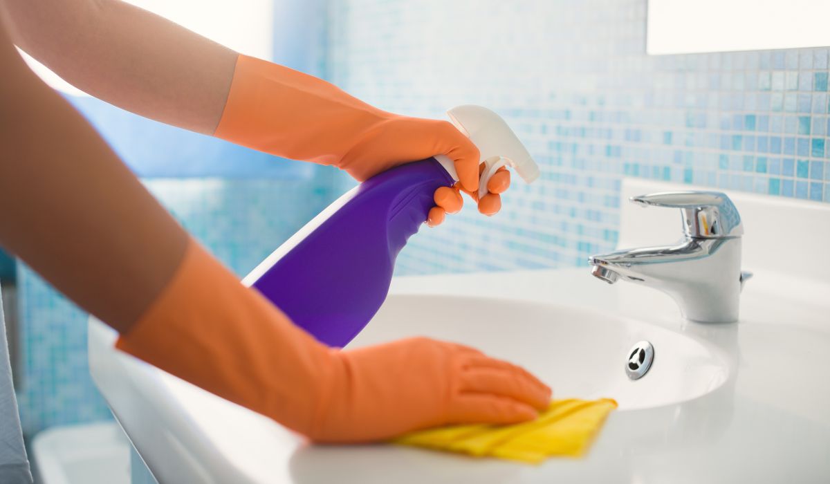 Woman cleaning sink