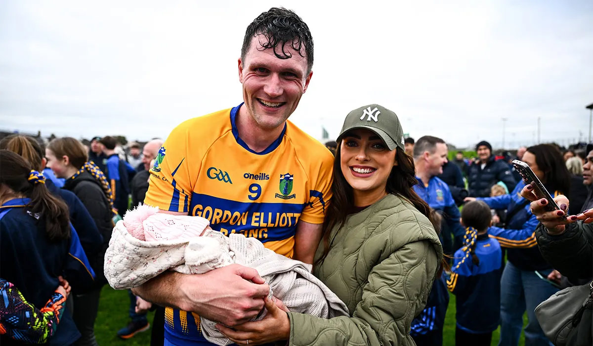 Adam Flanagan of Summerhill celebrates with his partner Jennifer and 2 week old daughter Isla after the Meath County Senior Club Football Championship final match between Ratoath and Summerhill at Páirc Tailteann in Navan, Meath. Pic: Ben McShane/Sportsfile