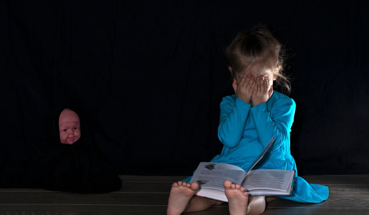Child covering eyes Halloween