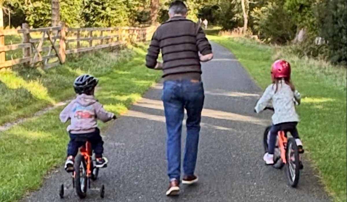 Simon Harris with his kids on bikes