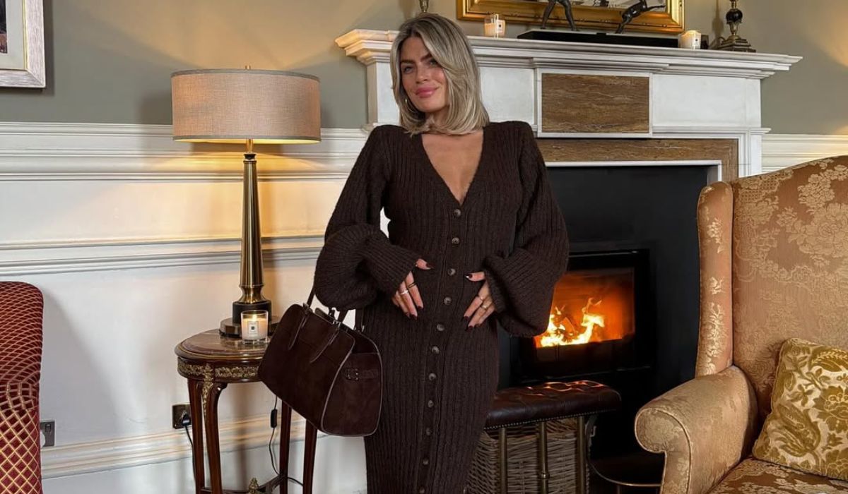 Lauren Arthurs at her baby shower in a brown dress