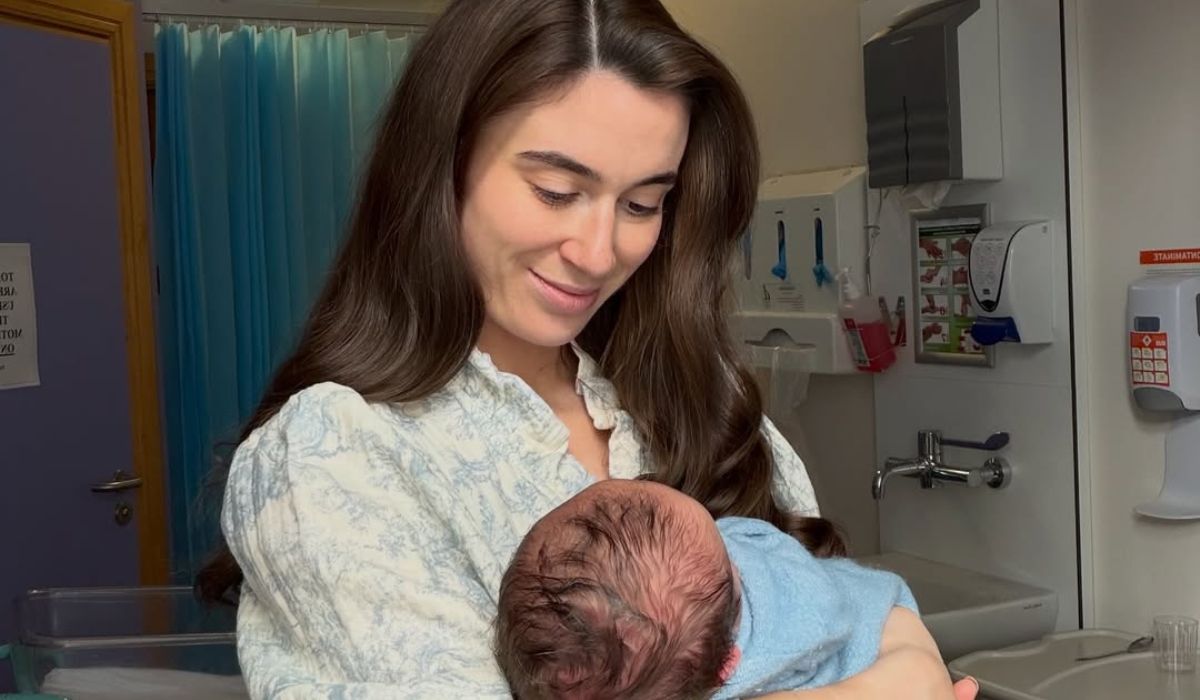 Aoife O Sullivan holding her newborn son