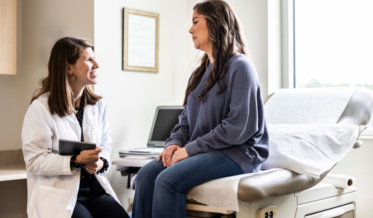 Woman talking to her GP