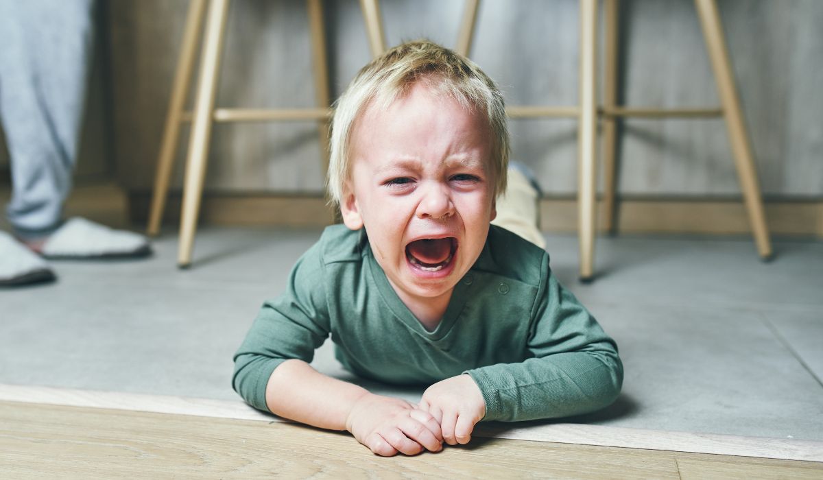 Toddler having a tantrum on the floor