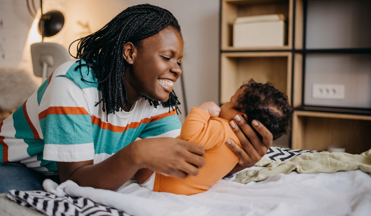 Mother changing baby's nappy