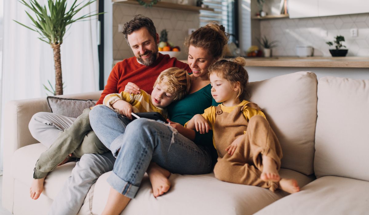 Family sitting together on couch